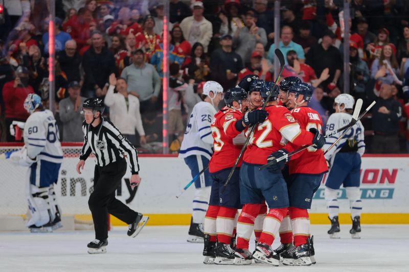Apr 8, 2025; Sunrise, Florida, USA;  Florida Panthers defenseman Gustav Forsling (42) celebrates with teammates after scoring against the Toronto Maple Leafs during the first period at Amerant Bank Arena. Mandatory Credit: Sam Navarro-Imagn Images