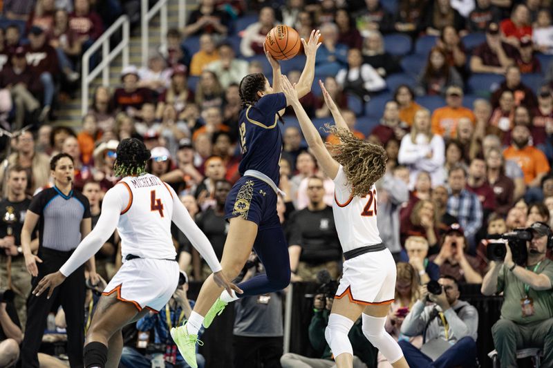 Mar 9, 2024; Greensboro, NC, USA; Notre Dame Fighting Irish forward Kylee Watson (22) shoots the ball over Virginia Tech Hokies guard Olivia Summiel (20) in the first half at Greensboro Coliseum. Mandatory Credit: David Yeazell-USA TODAY Sports