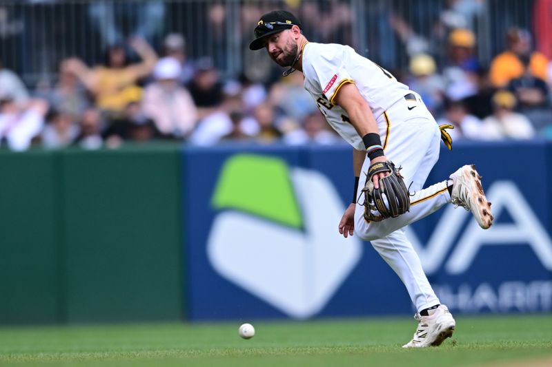 May 4, 2025; Pittsburgh, Pennsylvania, USA; Pittsburgh Pirates second baseman Jared Triolo (19) watches as a ball hit by San Diego Padres first baseman Luis Arraez (4) gets past him during the sixth inning at PNC Park. Mandatory Credit: David Dermer-Imagn Images