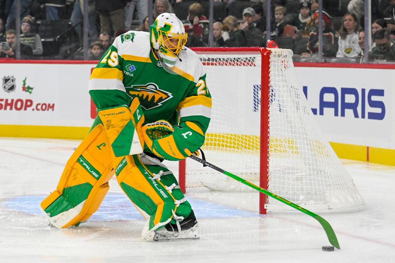 Nov 29, 2024; Saint Paul, Minnesota, USA;  Minnesota Wild goalie Marc-Andre Fleury (29) sets the puck up against the Chicago Blackhawks during the first period Xcel at Energy Center. Mandatory Credit: Nick Wosika-Imagn Images