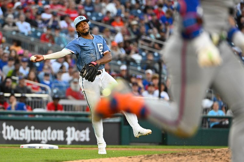 Apr 26, 2025; Washington, District of Columbia, USA; Washington Nationals third baseman José Tena (8) throws out New York Mets second baseman Jeff McNeil (1) during the seventh inning at Nationals Park. Mandatory Credit: Brad Mills-Imagn Images