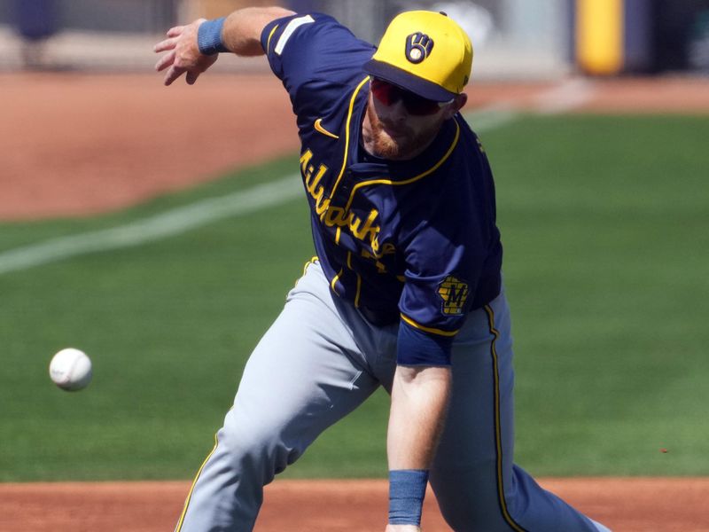 Mar 14, 2024; Peoria, Arizona, USA; Milwaukee Brewers third baseman Oliver Dunn (79) fields a ground ball against the Seattle Mariners during the third inning at Peoria Sports Complex. Mandatory Credit: Joe Camporeale-USA TODAY Sports