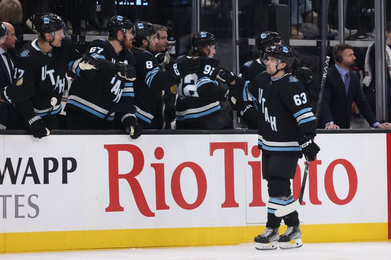 Jan 16, 2025; Salt Lake City, Utah, USA; Utah Hockey Club left wing Matias Maccelli (63) celebrates a goal against the New York Rangers during the first period at Delta Center. Mandatory Credit: Rob Gray-Imagn Images