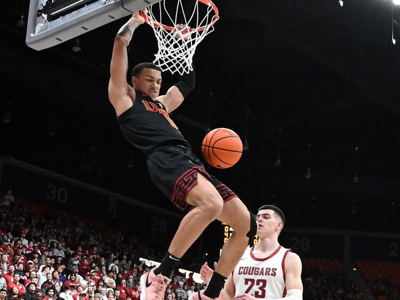 Feb 29, 2024; Pullman, Washington, USA; USC Trojans guard Kobe Johnson (0) dunks the ball against Washington State Cougars forward Andrej Jakimovski (23) in the first half at Friel Court at Beasley Coliseum. Mandatory Credit: James Snook-USA TODAY Sports