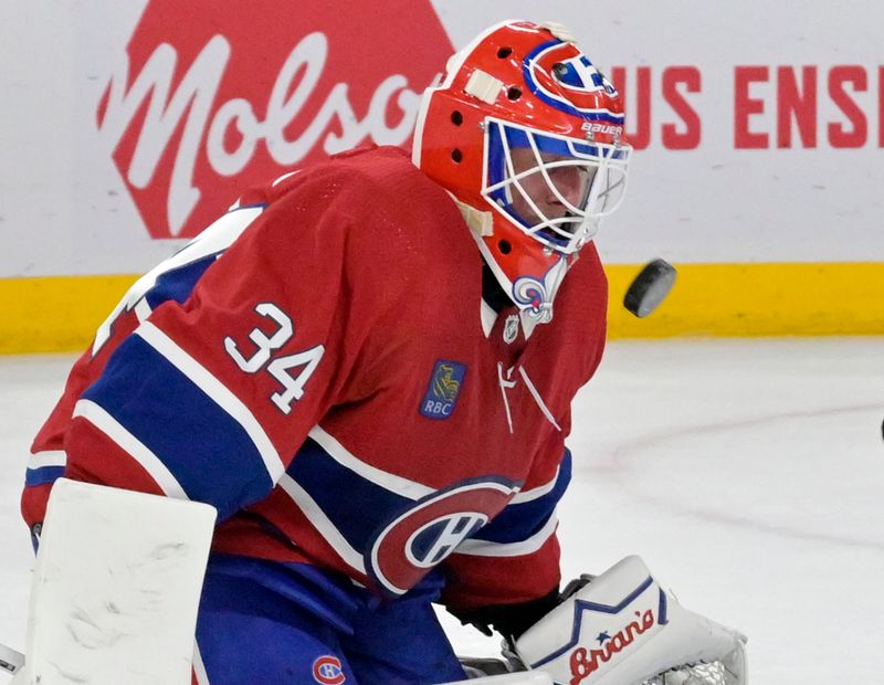 Feb 17, 2024; Montreal, Quebec, CAN; Montreal Canadiens goalie Jake Allen (34) makes a save during the third period of the game against the Washington Capitals at the Bell Centre. Mandatory Credit: Eric Bolte-USA TODAY Sports