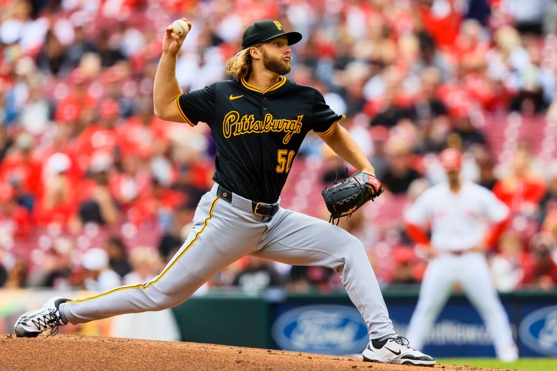 Apr 13, 2025; Cincinnati, Ohio, USA; Pittsburgh Pirates starting pitcher Carmen Mlodzinski (50) pitches against the Cincinnati Reds in the first inning at Great American Ball Park. Mandatory Credit: Katie Stratman-Imagn Images