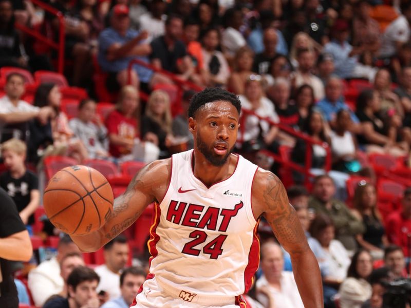 MIAMI, FL - APRIL 14:  Haywood Highsmith #24 of the Miami Heat handles the ball during the game  on April 14, 2024 at Kaseya Center in Miami, Florida. NOTE TO USER: User expressly acknowledges and agrees that, by downloading and or using this Photograph, user is consenting to the terms and conditions of the Getty Images License Agreement. Mandatory Copyright Notice: Copyright 2024 NBAE (Photo by Issac Baldizon/NBAE via Getty Images)