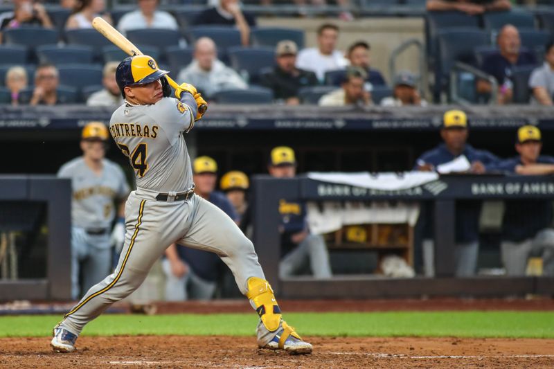 Sep 9, 2023; Bronx, New York, USA; Milwaukee Brewers catcher William Contreras (24) hits a single in the eighth inning against the New York Yankees at Yankee Stadium. Mandatory Credit: Wendell Cruz-USA TODAY Sports