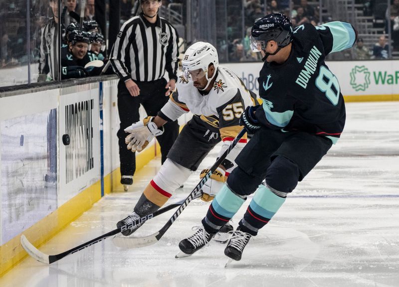 Mar 12, 2024; Seattle, Washington, USA; Vegas Golden Knights forward Keegan Kolesar (55) and Seattle Kraken defenseman Brian Dumoulin (8) battle of the puck during the first period at Climate Pledge Arena. Mandatory Credit: Stephen Brashear-USA TODAY Sports