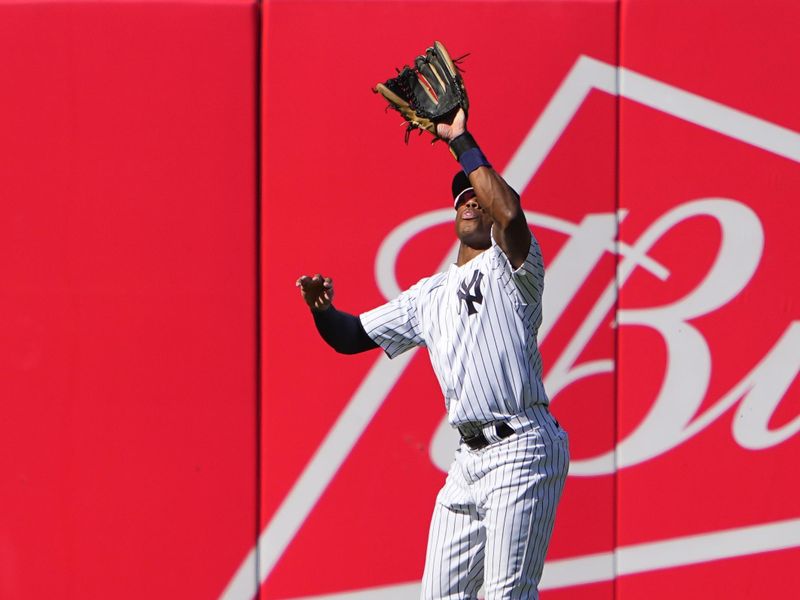 May 28, 2023; Bronx, New York, USA; New York Yankees center fielder Greg Allen (30) catches a fly ball hit by San Diego Padres catcher Brett Sullivan (29) (not pictured) during the ninth inning at Yankee Stadium. Mandatory Credit: Gregory Fisher-USA TODAY Sports