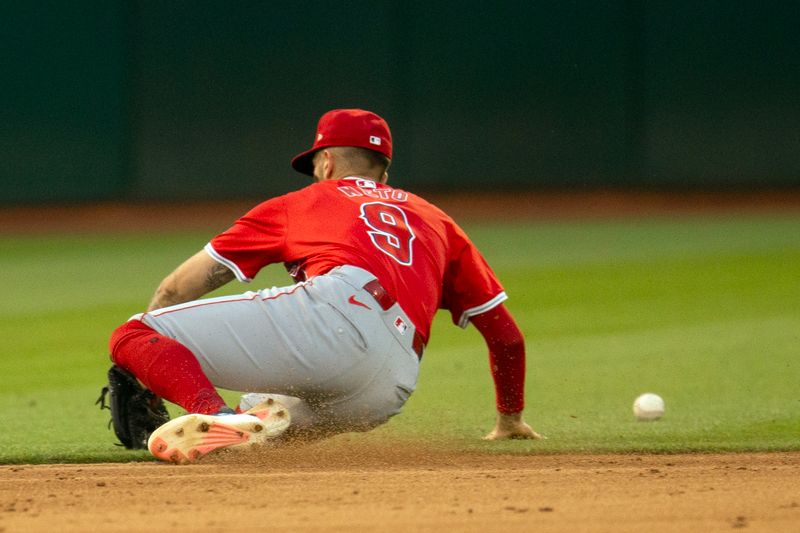 Jul 3, 2024; Oakland, California, USA; Los Angeles Angels shortstop Zach Neto (9) cannot snare an RBI single by Oakland Athletics third baseman Brett Harris during the sixth inning at Oakland-Alameda County Coliseum. Mandatory Credit: D. Ross Cameron-USA TODAY Sports