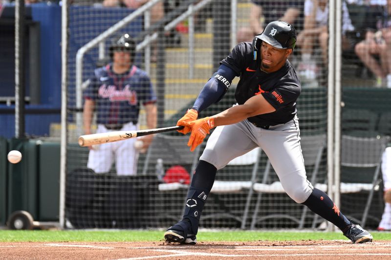 Mar 5, 2024; North Port, Florida, USA; Detroit Tigers center fielder Wenceel Perez (46) reaches for a pitch in the first inning of the spring training game against the Atlanta Braves  at CoolToday Park. Mandatory Credit: Jonathan Dyer-USA TODAY Sports