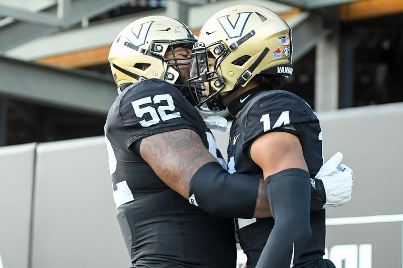 Sep 30, 2023; Nashville, Tennessee, USA;  Vanderbilt Commodores offensive lineman Kevo Wesley (52) celebrates the touchdown of wide receiver Will Sheppard (14) during the second half at FirstBank Stadium. Mandatory Credit: Steve Roberts-USA TODAY Sports