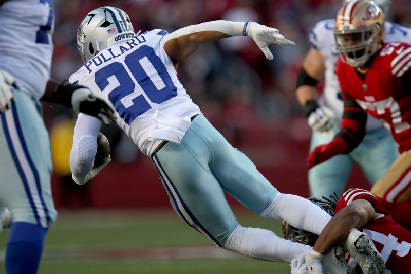 Dallas Cowboys running back Tony Pollard (20) is tackled by San Francisco 49ers linebacker Fred Warner (54) during an NFL divisional round playoff football game, Sunday, Jan. 22, 2023, in Santa Clara, Calif. (AP Photo/Scot Tucker)