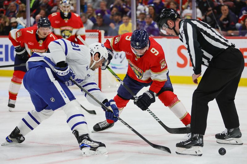 Apr 16, 2024; Sunrise, Florida, USA; Florida Panthers center Sam Bennett (9) and Toronto Maple Leafs center John Tavares (91) face-off during the first period at Amerant Bank Arena. Mandatory Credit: Sam Navarro-USA TODAY Sports