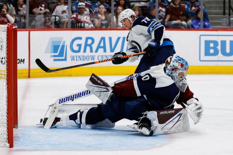 Apr 13, 2024; Denver, Colorado, USA; Colorado Avalanche goaltender Justus Annunen (60) makes a save on a shot from Winnipeg Jets center Tyler Toffoli (73) in the third period at Ball Arena. Mandatory Credit: Isaiah J. Downing-USA TODAY Sports