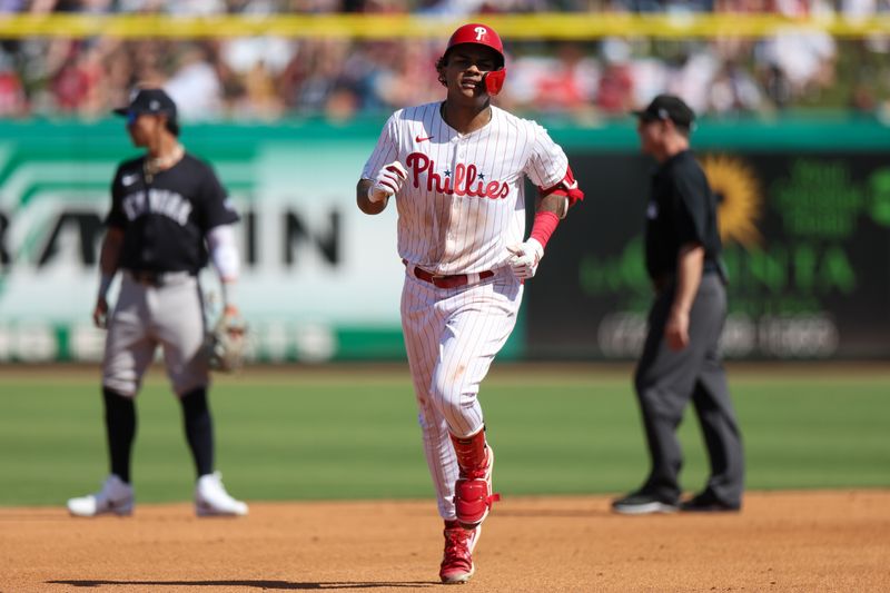 Feb 25, 2024; Clearwater, Florida, USA;  Philadelphia Phillies centerfielder Cristian Pache (19) runs the bases after hitting a solo home run against the New York Yankees in the fourth inning at BayCare Ballpark. Mandatory Credit: Nathan Ray Seebeck-USA TODAY Sports