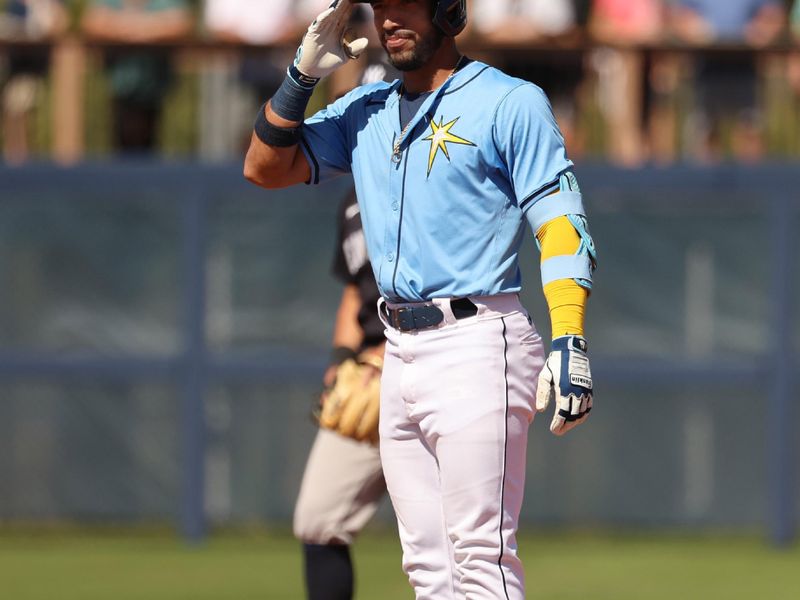 Feb 27, 2024; Port Charlotte, Florida, USA;  Tampa Bay Rays second baseman Jose Caballero (7) celebrates after hitting a double during the fifth inning against the New York Yankees at Charlotte Sports Park. Mandatory Credit: Kim Klement Neitzel-USA TODAY Sports