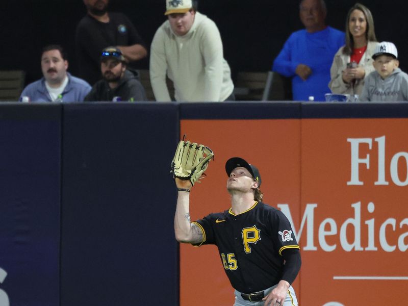 Mar 3, 2025; Tampa, Florida, USA;  Pittsburgh Pirates outfielder Jack Suwinski (65) catches a fly ball during the third inning  against the New York Yankees at George M. Steinbrenner Field. Mandatory Credit: Kim Klement Neitzel-Imagn Images