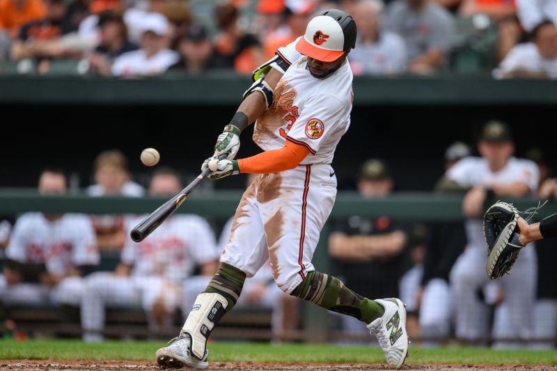 May 19, 2024; Baltimore, Maryland, USA; Baltimore Orioles second base Jorge Mateo (3) hits a single during the second inning against the Seattle Mariners at Oriole Park at Camden Yards. Mandatory Credit: Reggie Hildred-USA TODAY Sports
