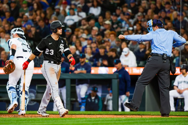 Jun 18, 2023; Seattle, Washington, USA; Chicago White Sox left fielder Andrew Benintendi (23) walks to the dugout after striking out against the Seattle Mariners to end the eighth inning at T-Mobile Park. Mandatory Credit: Joe Nicholson-USA TODAY Sports