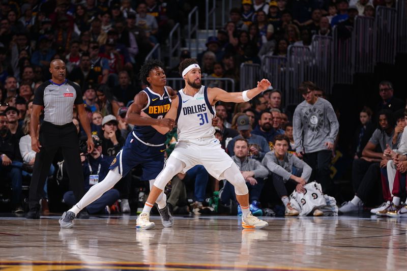 DENVER, CO - NOVEMBER 10: Klay Thompson #31 of the Dallas Mavericks posts up against Peyton Watson #8 of the Denver Nuggets during a regular season game on November 10, 2024 at Ball Arena in Denver, Colorado. NOTE TO USER: User expressly acknowledges and agrees that, by downloading and/or using this Photograph, user is consenting to the terms and conditions of the Getty Images License Agreement. Mandatory Copyright Notice: Copyright 2024 NBAE (Photo by Bart Young/NBAE via Getty Images)