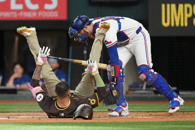 Jul 3, 2024; Arlington, Texas, USA; San Diego Padres third baseman Manny Machado (13) falls reacting to an inside pitch thrown by Texas Rangers starting pitcher Jon Gray (2not shown) during the first inning at Globe Life Field. Mandatory Credit: Jim Cowsert-USA TODAY Sports