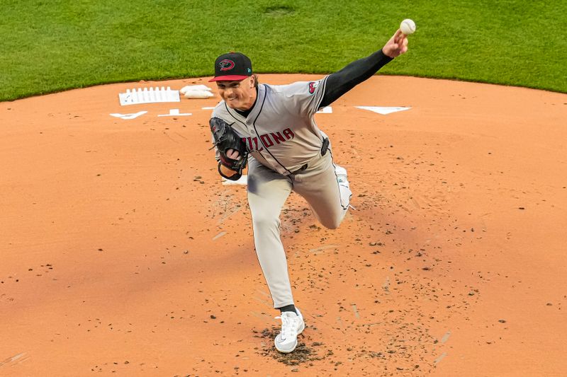 Apr 5, 2024; Cumberland, Georgia, USA; Arizona Diamondbacks starting pitcher Tommy Henry (47) pitches against the Atlanta Braves during the first inning at Truist Park. Mandatory Credit: Dale Zanine-USA TODAY Sports