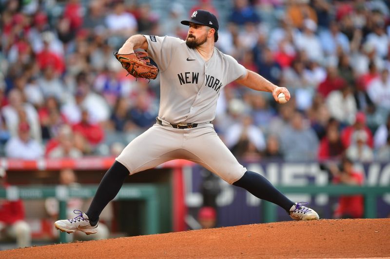 May 27, 2025; Anaheim, California, USA; New York Yankees pitcher Carlos Rodón (55) throws against the Los Angeles Angels during the first inning at Angel Stadium. Mandatory Credit: Gary A. Vasquez-Imagn Images
