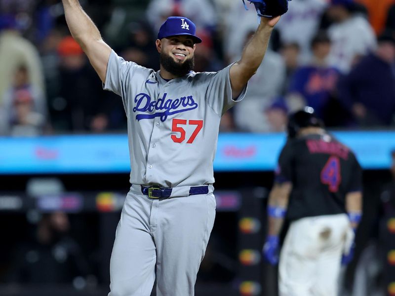 May 23, 2025; New York City, New York, USA; Los Angeles Dodgers relief pitcher Luis Garcia (57) reacts after getting New York Mets catcher Francisco Alvarez (4) to line out for the final out of the game during the thirteenth inning at Citi Field. Mandatory Credit: Brad Penner-Imagn Images