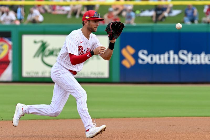 Mar 1, 2024; Clearwater, Florida, USA; Philadelphia Phillies shortstop Trea Turner (7) fields a ground ball in the first inning of the spring training game against the Miami Marlins at BayCare Ballpark. Mandatory Credit: Jonathan Dyer-USA TODAY Sports