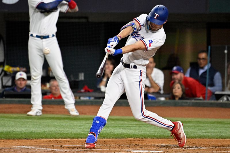 Oct 10, 2023; Arlington, Texas, USA; Texas Rangers center fielder Evan Carter (32) hits a single in the first inning against the Baltimore Orioles during game three of the ALDS for the 2023 MLB playoffs at Globe Life Field. Mandatory Credit: Jerome Miron-USA TODAY Sports