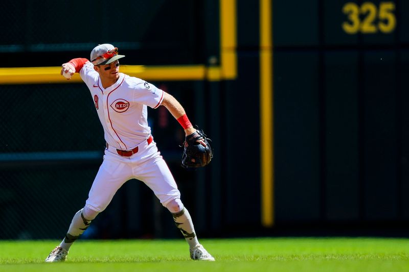 May 18, 2025; Cincinnati, Ohio, USA; Cincinnati Reds second baseman Matt McLain (9) throws to first to get Cleveland Guardians second baseman Daniel Schneemann (not pictured) out in the sixth inning at Great American Ball Park. Mandatory Credit: Katie Stratman-Imagn Images