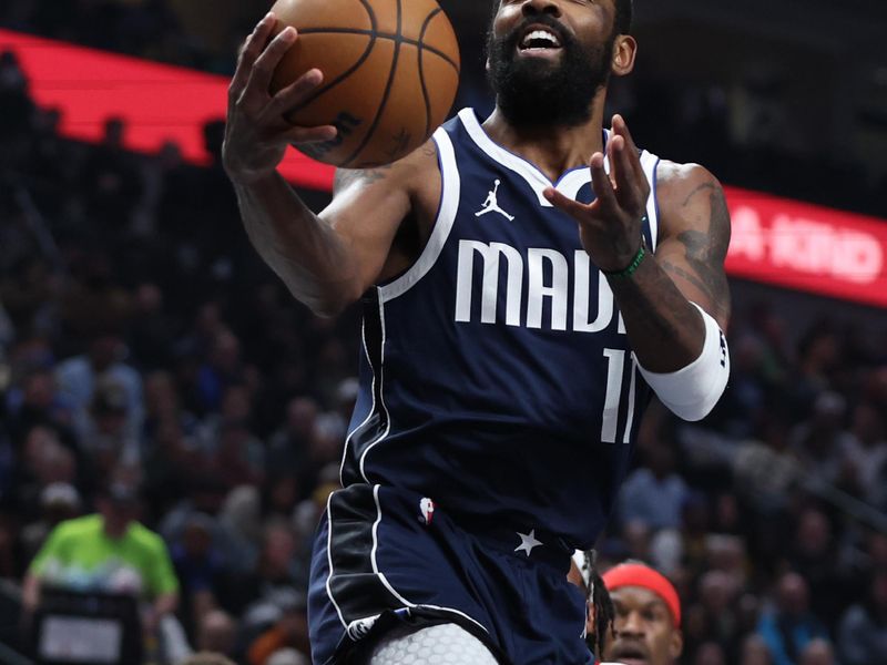 DALLAS, TX - FEBRUARY 12:  Kyrie Irving #11 of the Dallas Mavericks handles the ball during the game against the Golden State Warriors on February 12, 2025 at American Airlines Center in Dallas, Texas. NOTE TO USER: User expressly acknowledges and agrees that, by downloading and or using this photograph, User is consenting to the terms and conditions of the Getty Images License Agreement. Mandatory Copyright Notice: Copyright 2025 NBAE (Photo by Tim Heitman/NBAE via Getty Images)