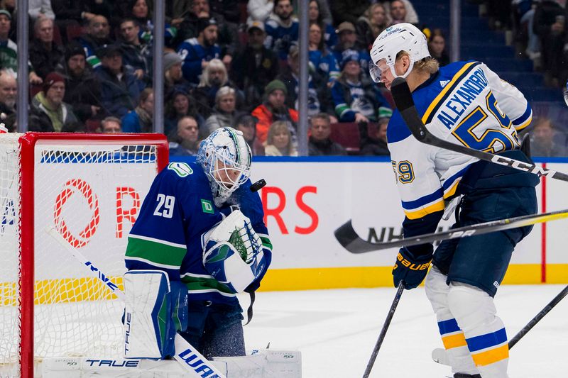 Jan 24, 2024; Vancouver, British Columbia, CAN; St. Louis Blues forward Nikita Alexandrov (59) looks for the rebound from Vancouver Canucks goalie Casey DeSmith (29) in the second period at Rogers Arena. Mandatory Credit: Bob Frid-USA TODAY Sports