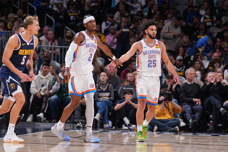 DENVER, CO - NOVEMBER 6:  Shai Gilgeous-Alexander #2 and Ajay Mitchell #25 of the Oklahoma City Thunder high five during the game against the Denver Nuggets during a regular season game on November 6, 2024 at Ball Arena in Denver, Colorado. NOTE TO USER: User expressly acknowledges and agrees that, by downloading and/or using this Photograph, user is consenting to the terms and conditions of the Getty Images License Agreement. Mandatory Copyright Notice: Copyright 2024 NBAE (Photo by Bart Young/NBAE via Getty Images)