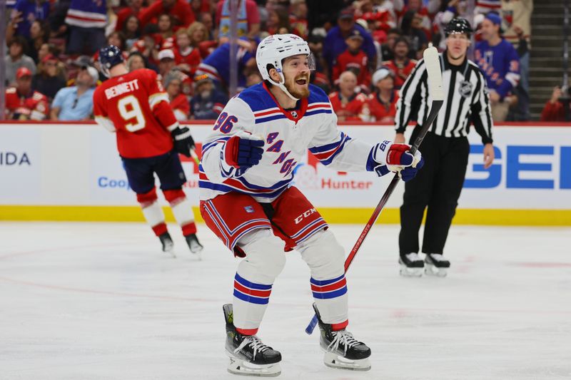 May 26, 2024; Sunrise, Florida, USA; New York Rangers center Jack Roslovic (96) celebrates after a game-winning goal by center Alex Wennberg (not pictured) during overtime in game three of the Eastern Conference Final of the 2024 Stanley Cup Playoffs at Amerant Bank Arena. Mandatory Credit: Sam Navarro-USA TODAY Sports