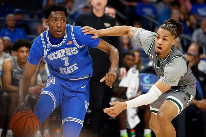 Mar 3, 2024; Memphis, Tennessee, USA; Memphis Tigers forward Nae'Qwan Tomlin (7) dribbles around UAB Blazers guard Daniel Ortiz (2) during the first half at FedExForum. Mandatory Credit: Petre Thomas-USA TODAY Sports