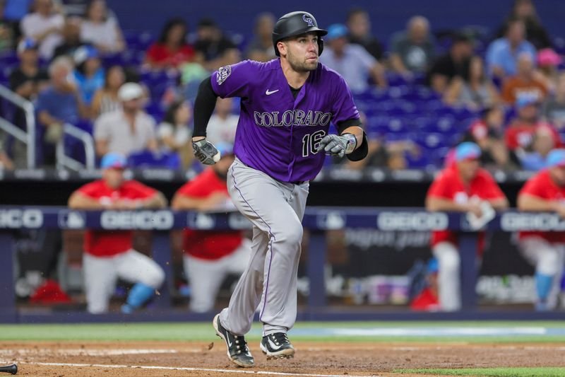 Jul 22, 2023; Miami, Florida, USA; Colorado Rockies catcher Austin Wynns (16) watches the ball after hitting a double against the Miami Marlins during the third inning at loanDepot Park. Mandatory Credit: Sam Navarro-USA TODAY Sports