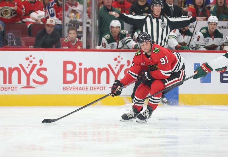 Oct 3, 2025; Chicago, Illinois, USA; Chicago Blackhawks center Frank Nazar (91) skates down ice during the first period against the Minnesota Wild at United Center. Mandatory Credit: Talia Sprague-Imagn Images