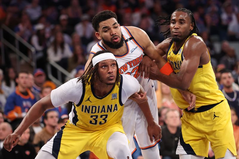 NEW YORK, NEW YORK - MAY 23: Karl-Anthony Towns #32 of the New York Knicks battles for position against Myles Turner #33 and Aaron Nesmith #23 of the Indiana Pacers during the fourth quarter in Game Two of the Eastern Conference Finals of the 2025 NBA Playoffs at Madison Square Garden on May 23, 2025 in New York City. NOTE TO USER: User expressly acknowledges and agrees that, by downloading and or using this photograph, User is consenting to the terms and conditions of the Getty Images License Agreement. (Photo by Elsa/Getty Images)