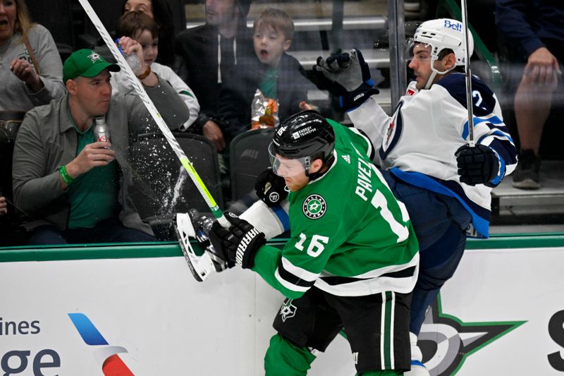 Apr 11, 2024; Dallas, Texas, USA; Dallas Stars center Joe Pavelski (16) checks Winnipeg Jets defenseman Dylan DeMelo (2) during the second period at the American Airlines Center. Mandatory Credit: Jerome Miron-USA TODAY Sports