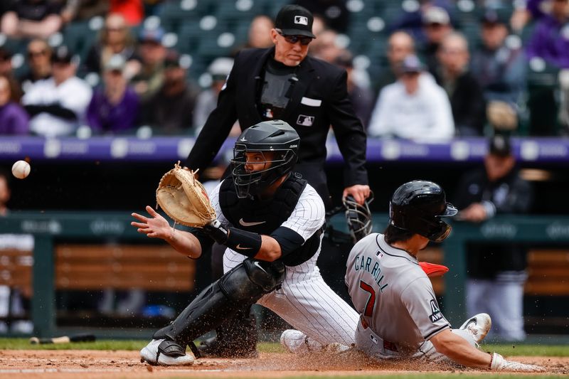 Apr 10, 2024; Denver, Colorado, USA; Arizona Diamondbacks center fielder Corbin Carroll (7) slides safely ahead of the tag from Colorado Rockies catcher Jacob Stallings (25) on an RBI in the seventh inning at Coors Field. Mandatory Credit: Isaiah J. Downing-USA TODAY Sports