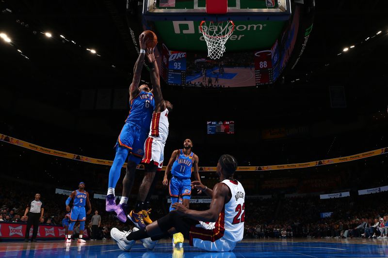 OKLAHOMA CITY, OK - MARCH 8:  Jaylin Williams #6 of the Oklahoma City Thunder grabs a rebound during the game against the Miami Heat on March 8, 2024 at Paycom Arena in Oklahoma City, Oklahoma. NOTE TO USER: User expressly acknowledges and agrees that, by downloading and or using this photograph, User is consenting to the terms and conditions of the Getty Images License Agreement. Mandatory Copyright Notice: Copyright 2024 NBAE (Photo by Zach Beeker/NBAE via Getty Images)