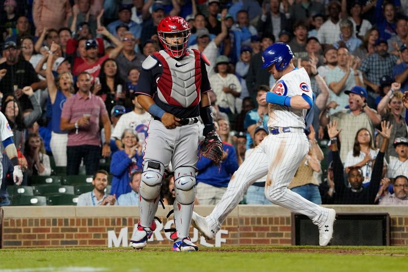 Jul 18, 2023; Chicago, Illinois, USA; Chicago Cubs left fielder Ian Happ (8) scores as Washington Nationals catcher Keibert Ruiz (20) stands nearby during the sixth inning at Wrigley Field. Mandatory Credit: David Banks-USA TODAY Sports