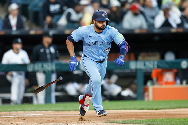 May 27, 2024; Chicago, Illinois, USA; Toronto Blue Jays third baseman Isiah Kiner-Falefa (7) runs to first base after hitting an RBI-single against the Chicago White Sox during the fourth inning at Guaranteed Rate Field. Mandatory Credit: Kamil Krzaczynski-USA TODAY Sports