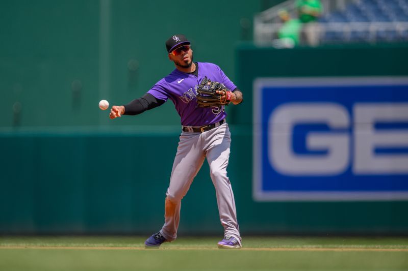 Jul 26, 2023; Washington, District of Columbia, USA; Colorado Rockies second baseman Harold Castro (30) throws to first base for the force out during the fifth inning against the Washington Nationals at Nationals Park. Mandatory Credit: Reggie Hildred-USA TODAY Sports