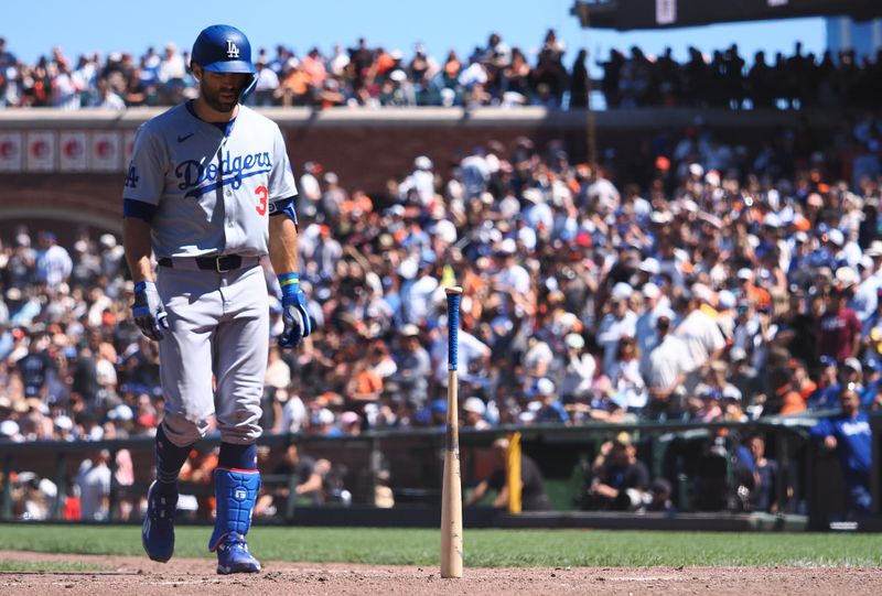 Jun 30, 2024; San Francisco, California, USA; Los Angeles Dodgers third baseman Chris Taylor (3) goes to retrieve his bat that the San Francisco Giants catcher stood on it’s end after a foul ball during the ninth inning at Oracle Park. Mandatory Credit: Kelley L Cox-USA TODAY Sports