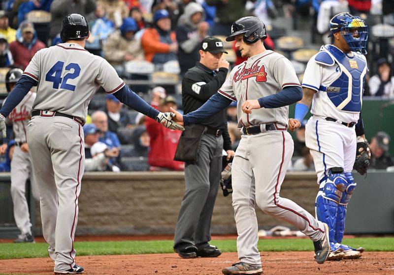 Apr 15, 2023; Kansas City, Missouri, USA;  Atlanta Braves catcher Sean Murphy (right) celebrates with Atlanta Braves Austin Riley (left) after scoring a run during the third inning against the Kansas City Royals at Kauffman Stadium. Mandatory Credit: Peter Aiken-USA TODAY Sports