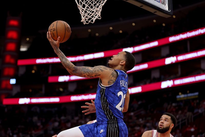 HOUSTON, TEXAS - APRIL 09: Markelle Fultz #20 of the Orlando Magic goes up for a lay up in the first half against the Houston Rockets at Toyota Center on April 09, 2024 in Houston, Texas.  NOTE TO USER: User expressly acknowledges and agrees that, by downloading and or using this photograph, User is consenting to the terms and conditions of the Getty Images License Agreement. (Photo by Tim Warner/Getty Images)